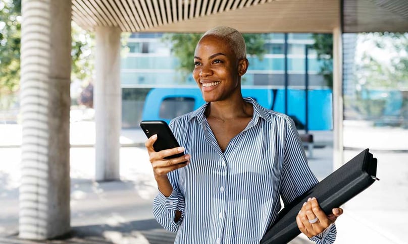 Lady with cell phone on her way